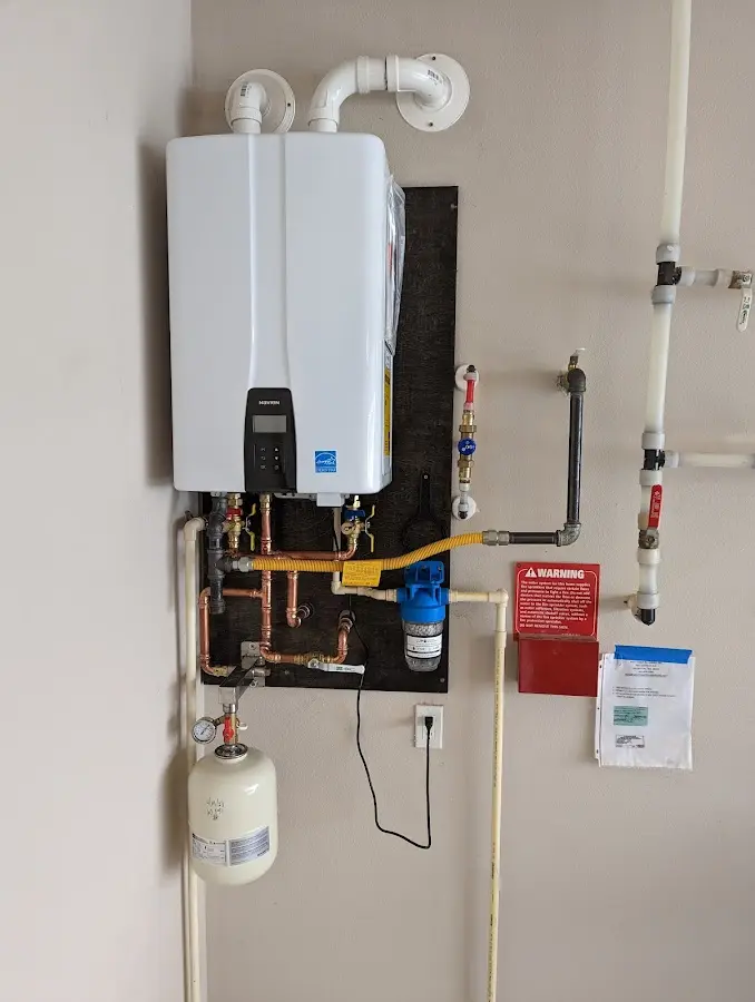 Professional plumber installing copper piping in a Wauwatosa home